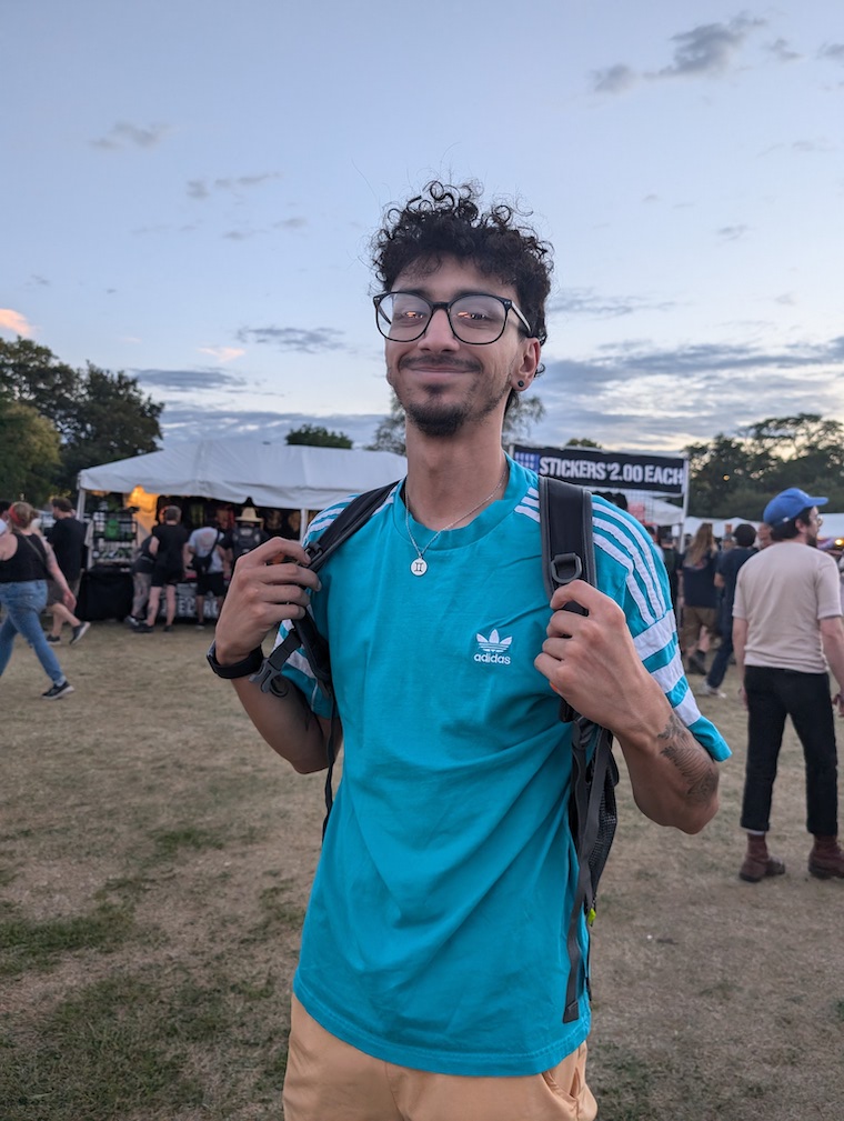 Happy young man in an Adi warmup