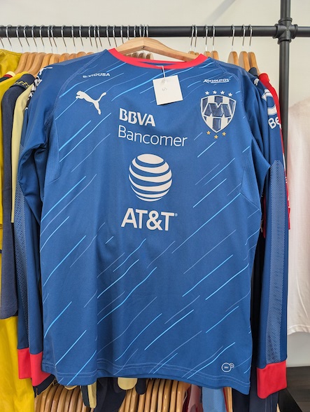 Liga MX is well represented and occupies one of the prominent racks in the shop. This 2018 Away Rayados kit, with its long sleeves, is more suited for Chicago's chill than Monterrey's warmth!